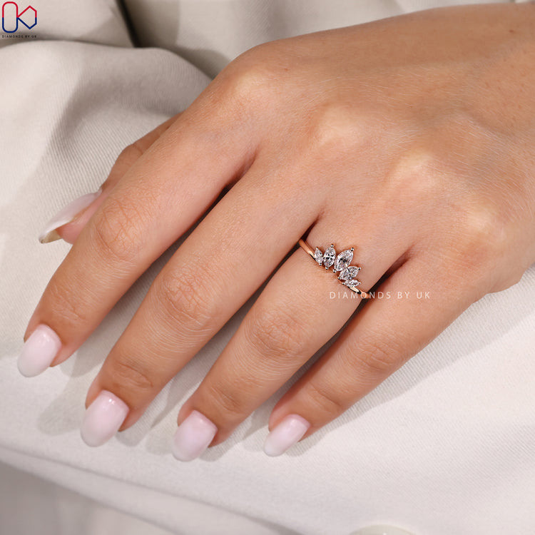 Prong setting on marquise wedding band.
