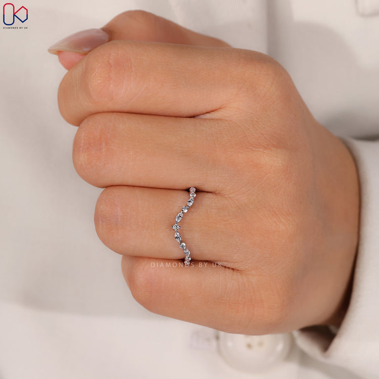 Shared prong wedding band with marquise and round diamonds.
