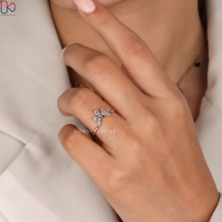 Prong setting on marquise diamond band.
