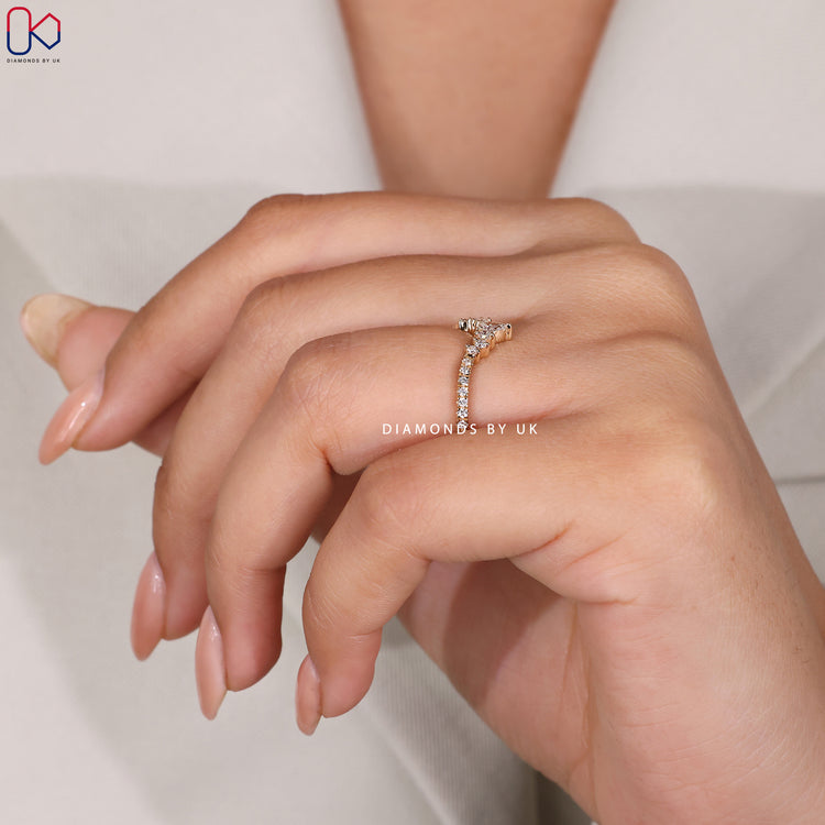 Prong set wedding band in yellow gold.
