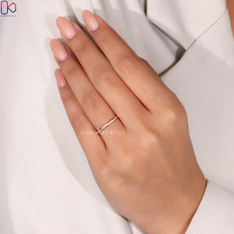 Diamondsbyuk wedding band with lab grown gypsy set stones.
