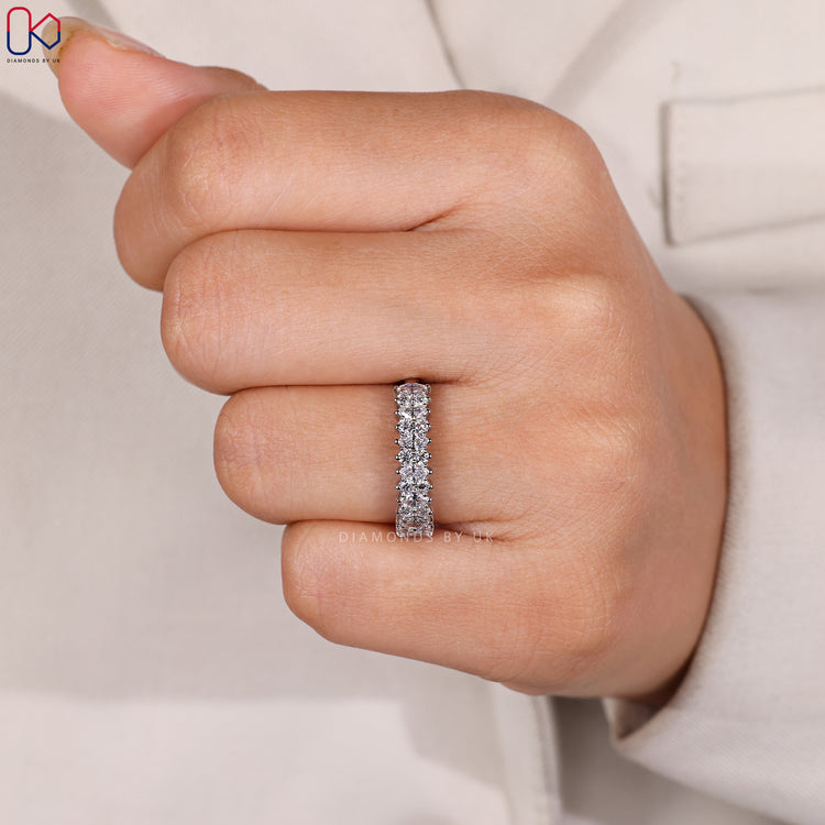 Handmade jewellery half eternity diamond band in white gold.
