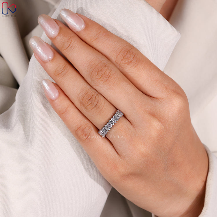 White gold half eternity band with round and marquise diamonds.
