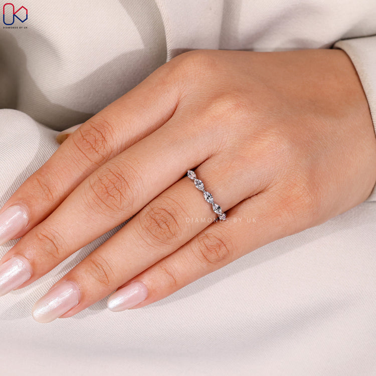 Shared prong wedding band with marquise diamonds.
