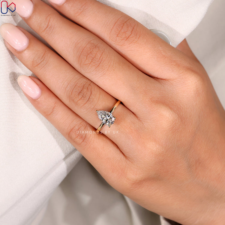 Handmade yellow gold solitaire engagement ring.
