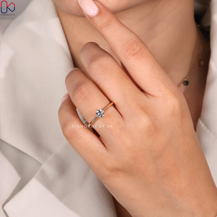 Tapered shank round cut diamond engagement ring.
