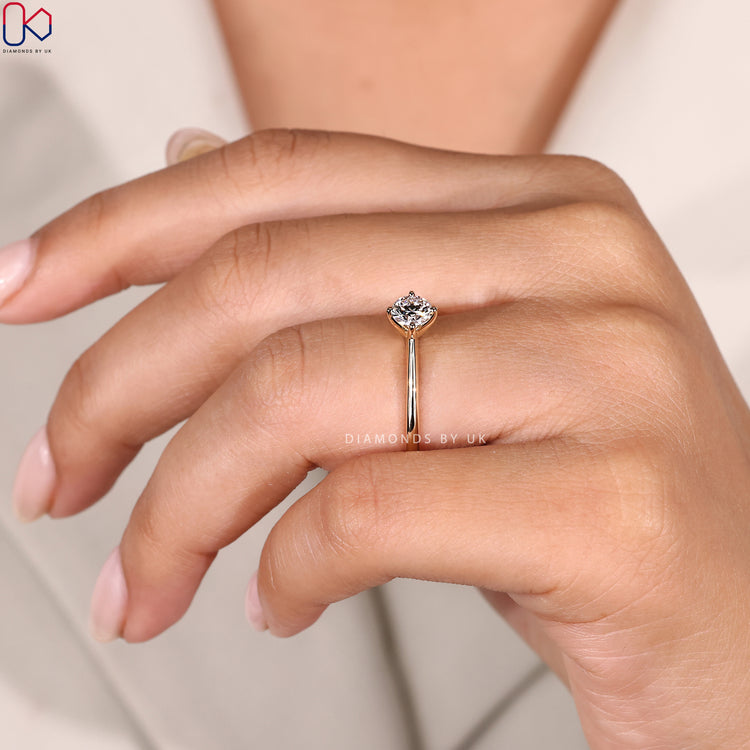 Compass prong setting round diamond engagement ring.
