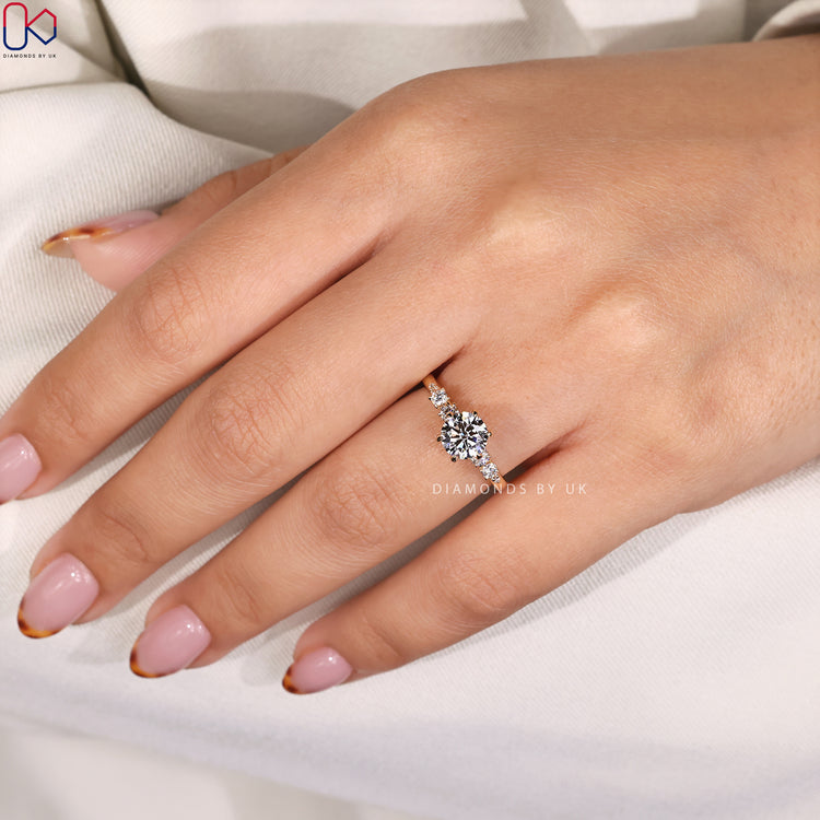 Lab grown diamond ring with round side stones.
