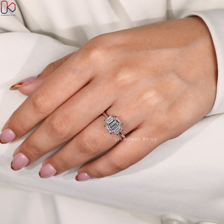 Buy diamond ring with custom three stone setting.

