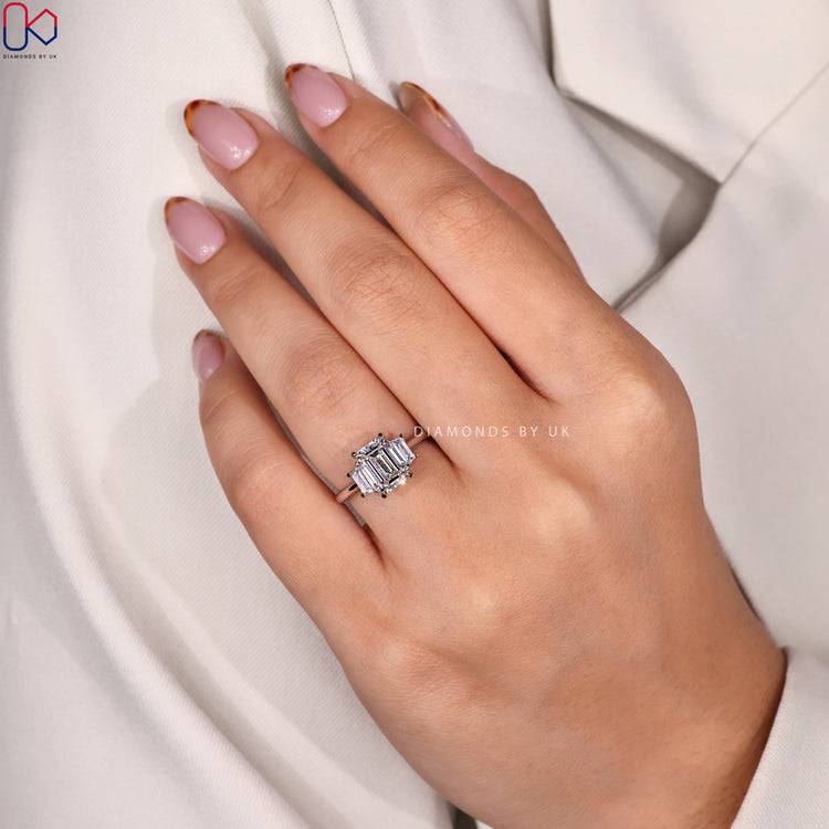 DiamondsbyUK ring in white gold with emerald cut diamond.
