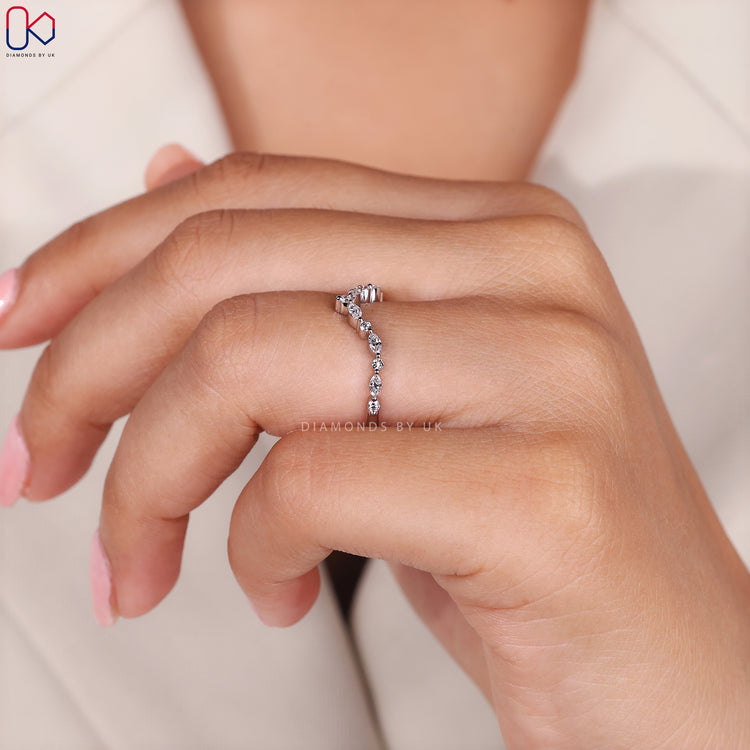 Shared prong wedding band with marquise and round stones.
