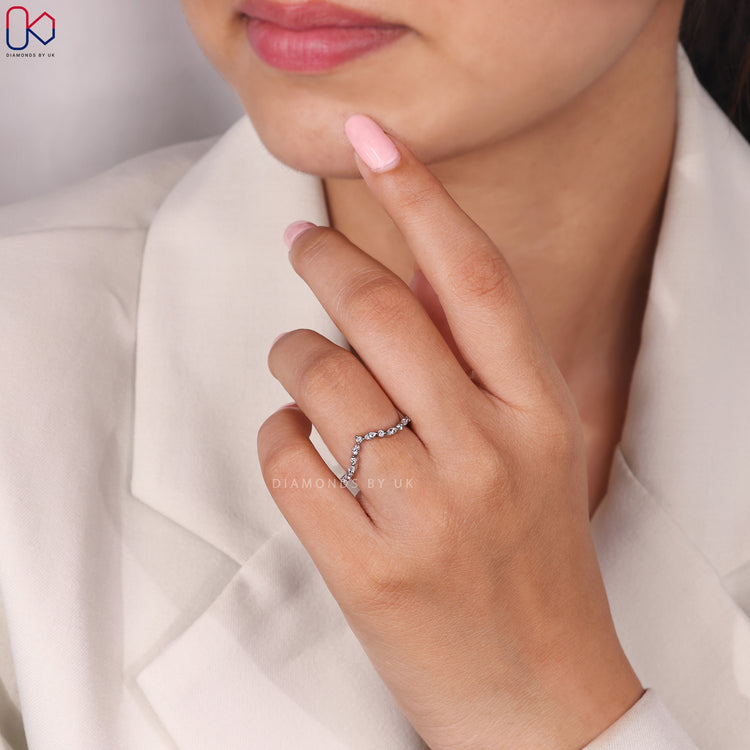 Custom diamond band with curved design.
