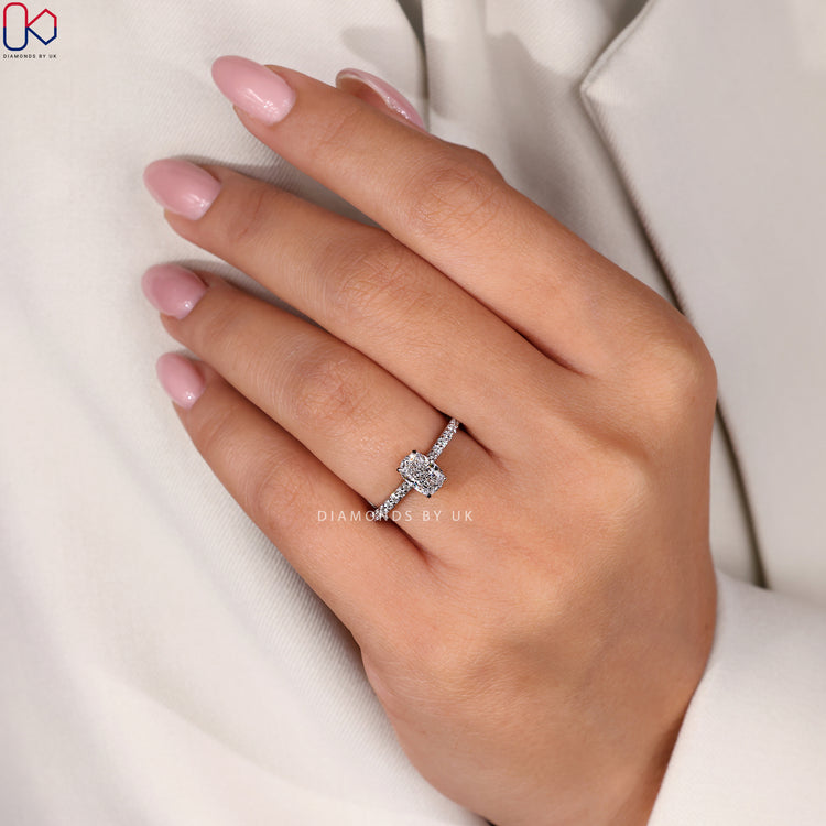 IGI Certified Handmade Ring with a cushion brilliant cut diamond, hidden halo, and round side stones in a cathedral setting.
