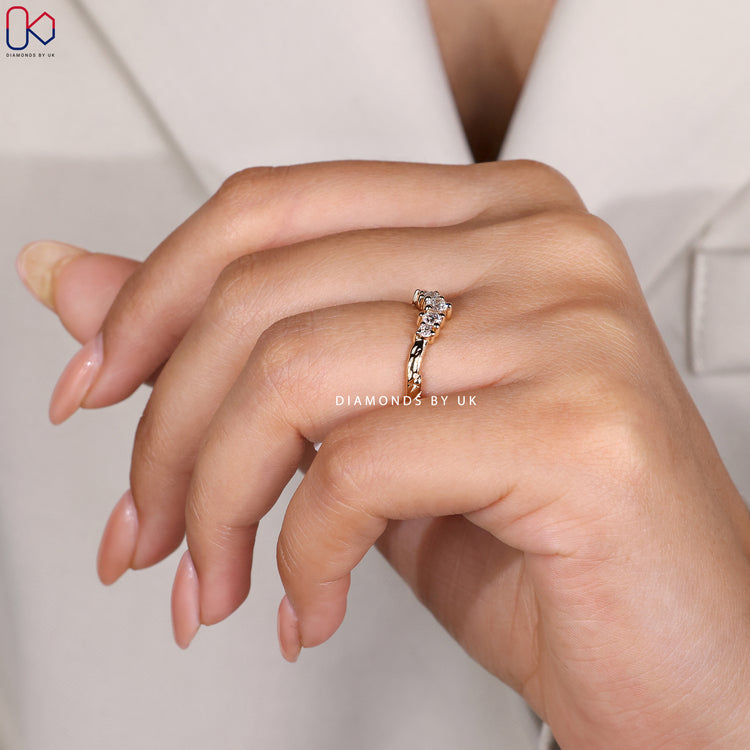 Diamondsbyuk yellow gold twig-inspired wedding band.
