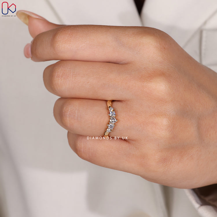 Custom yellow gold 5 stone wedding band.
