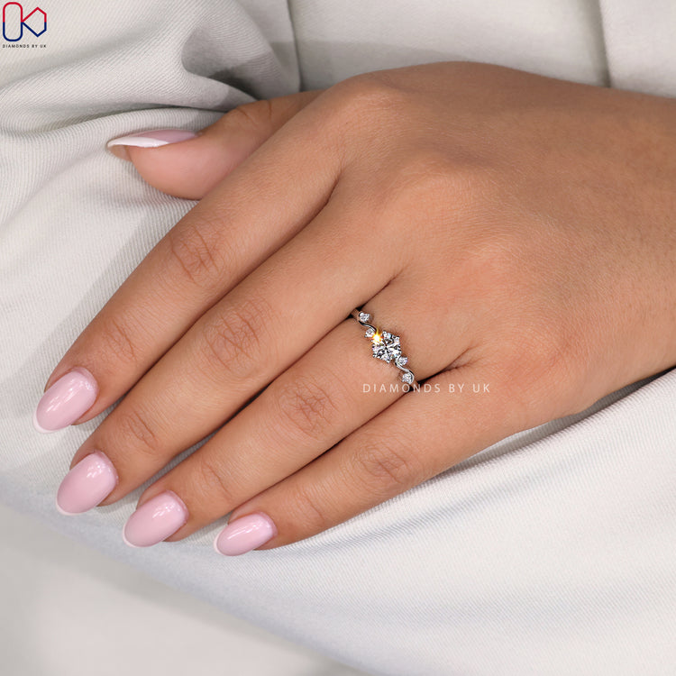 Side diamond ring featuring lab grown accents and handmade antique-style metalwork.