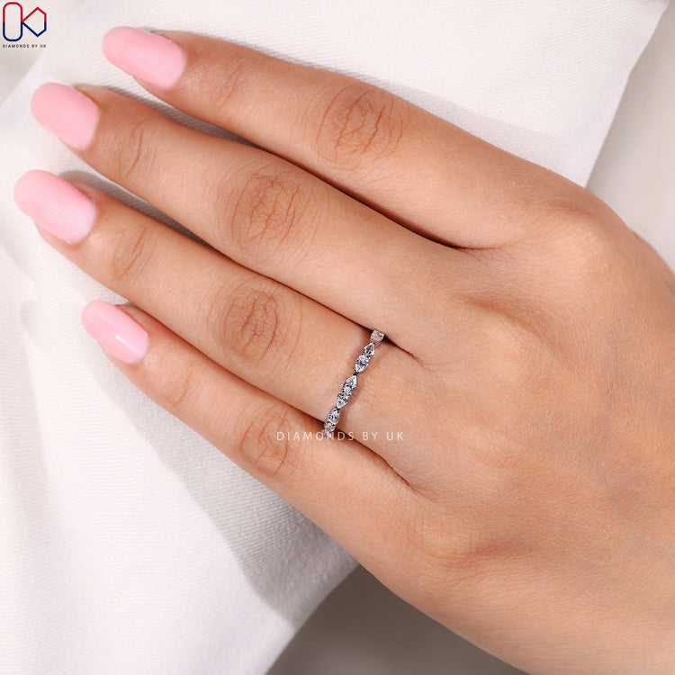 Buy wedding band with pear shaped diamond band.
