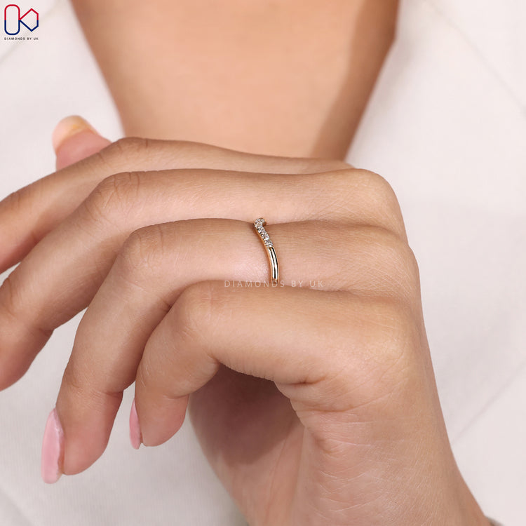 6 stone wedding band in yellow gold.
