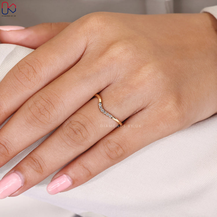 Handmade band with curved diamonds.
