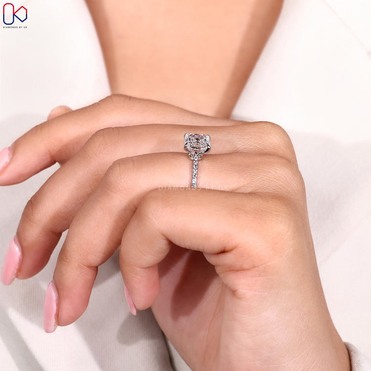 Four prong claw setting Asscher diamond engagement ring.
