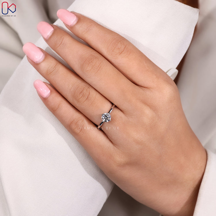 Compass prong setting round diamond engagement ring.

