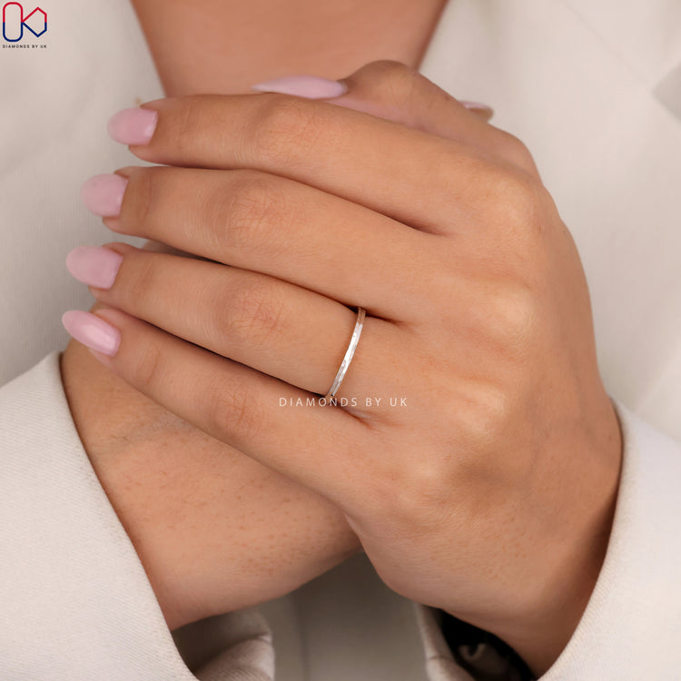 Hammered sterling band with custom wedding band style.
