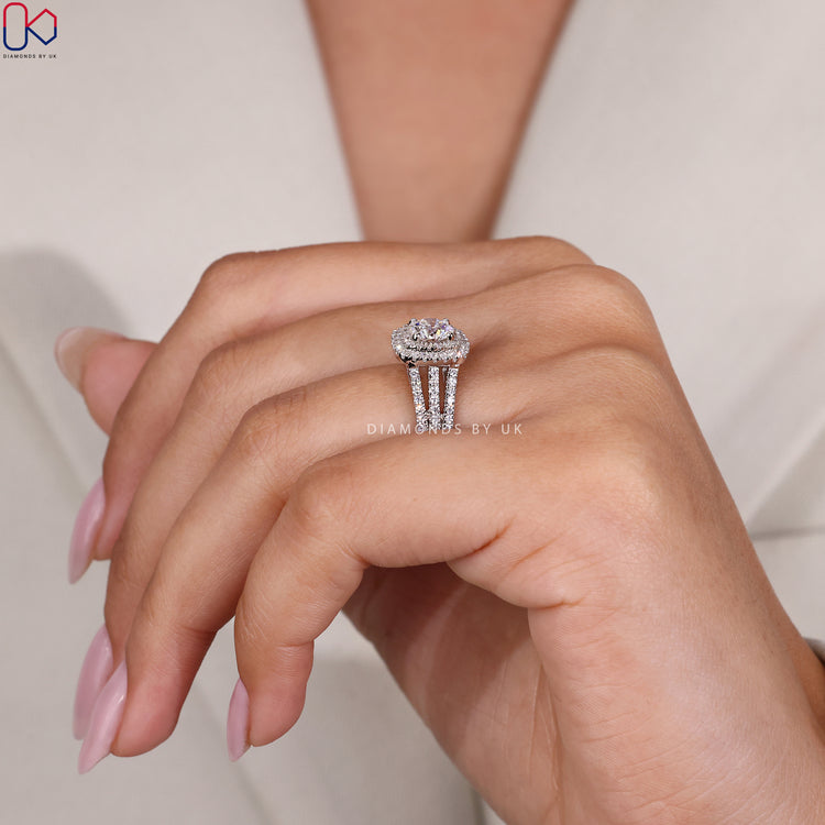 Handmade ring featuring a double halo around a round cut center stone.