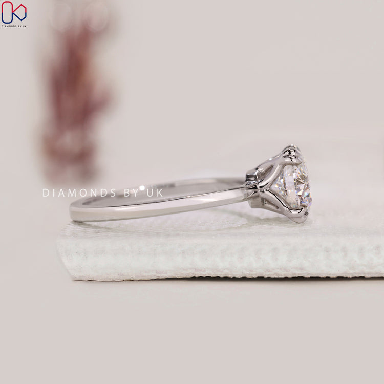Buy engagement ring with a lab-grown round diamond.
