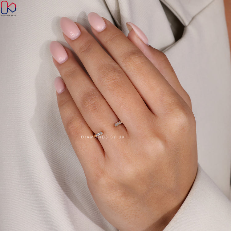Diamondsbyuk wedding band featuring round diamonds in prong setting.
