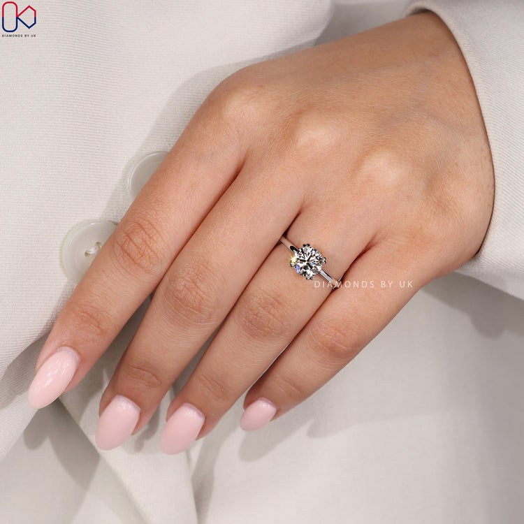 DiamondsbyUK ring with a round solitaire design.
