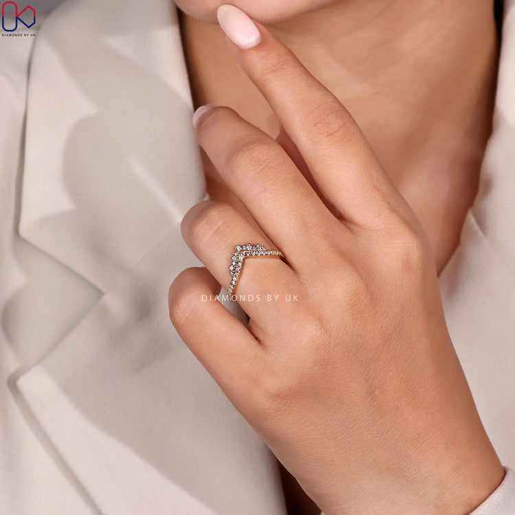 Round wedding band with prong setting band.
