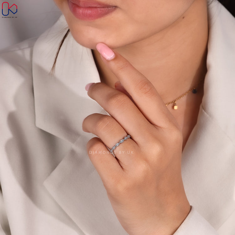 7 stone diamond band in white gold.
