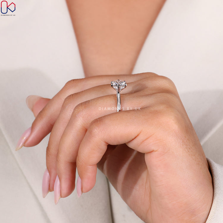 Tapered shank ring featuring a unique silhouette.
