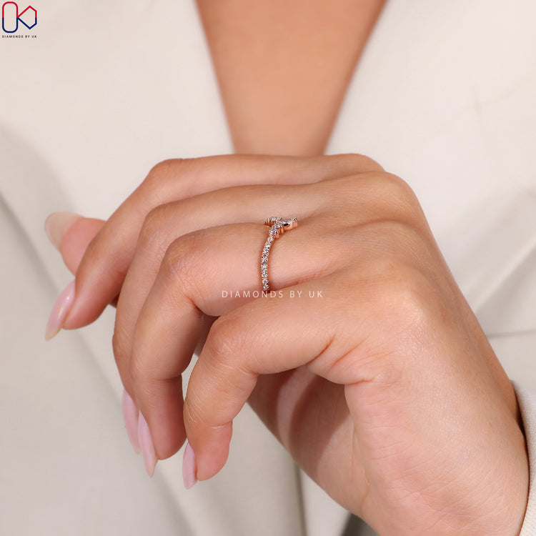 Rose gold wedding band with a romantic finish.