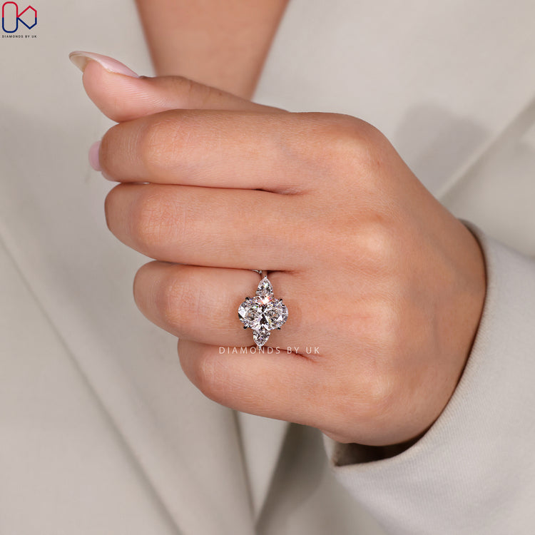 Pear cut side stone engagement ring for a unique look.
