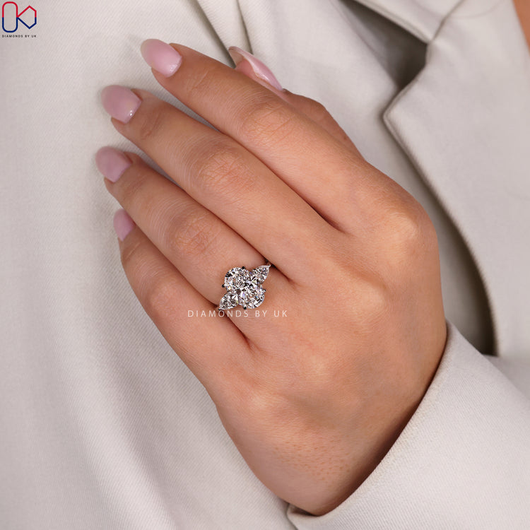 Handmade ring with oval and pear cut diamonds.
