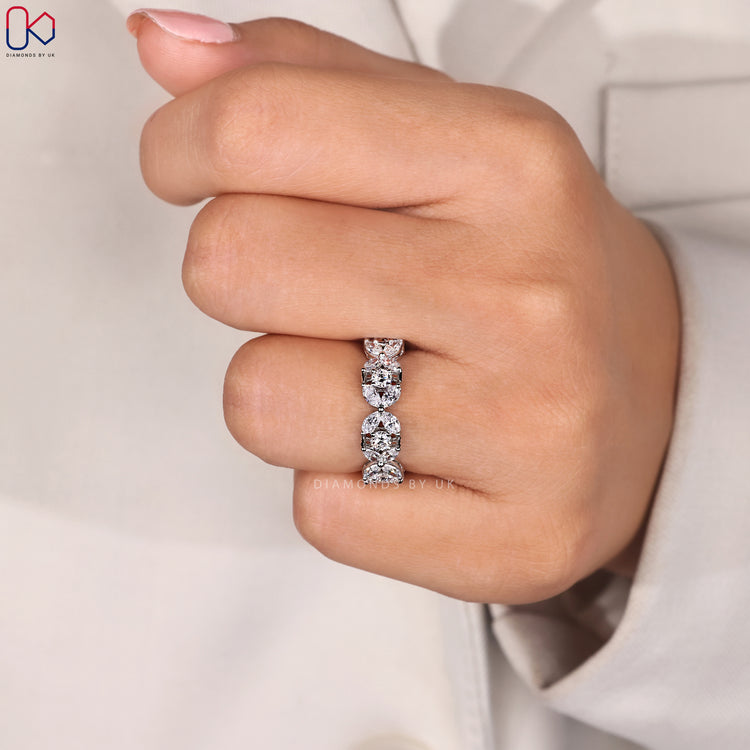 Wide wedding band with marquise and round diamonds.
