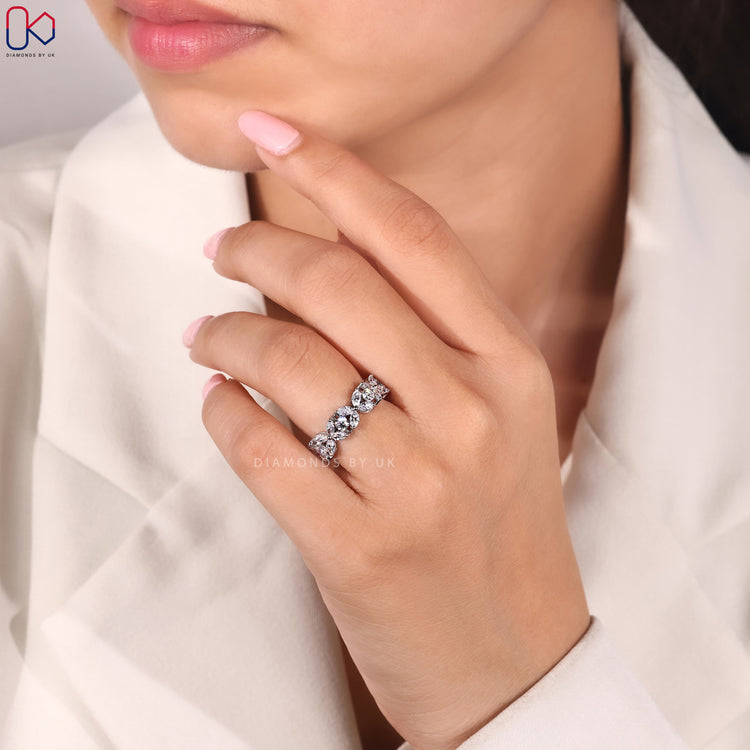 Shared prong wedding band with mixed diamond shapes.
