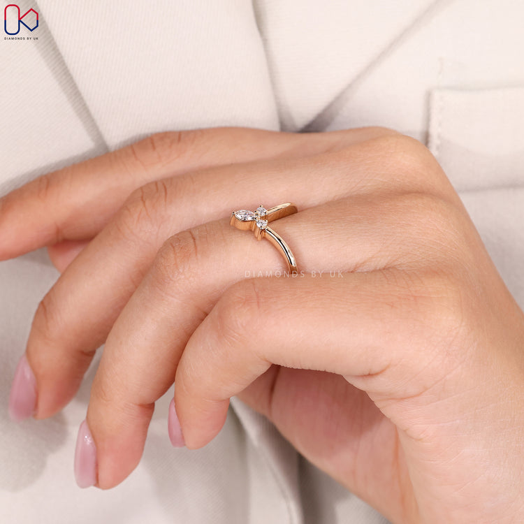 Yellow gold wedding band with v shaped design.
