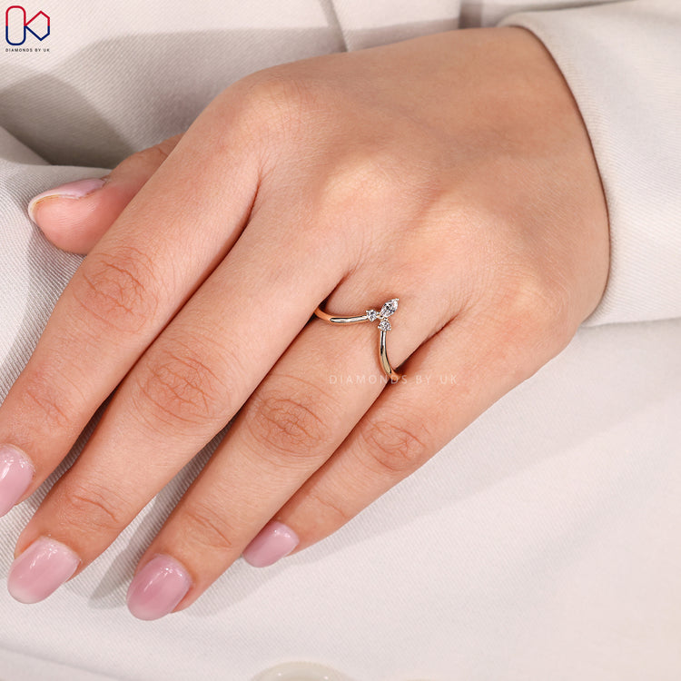 Handmade band with marquise and round diamonds.
