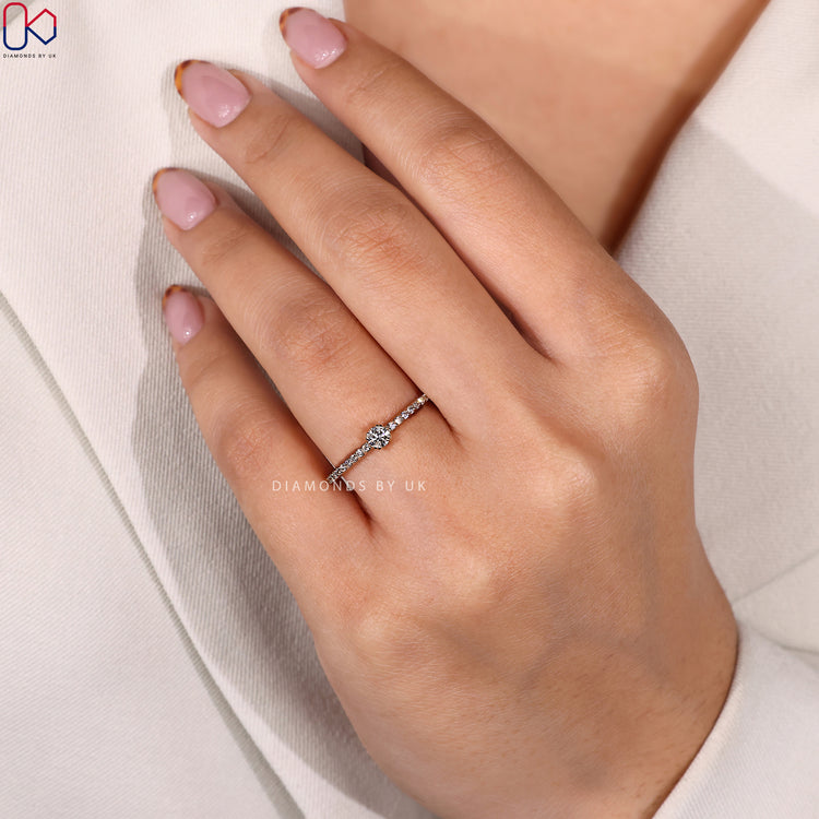 Elegant double prong ring with pave accent diamonds.
