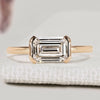 Emerald cut diamond ring with half bezel setting