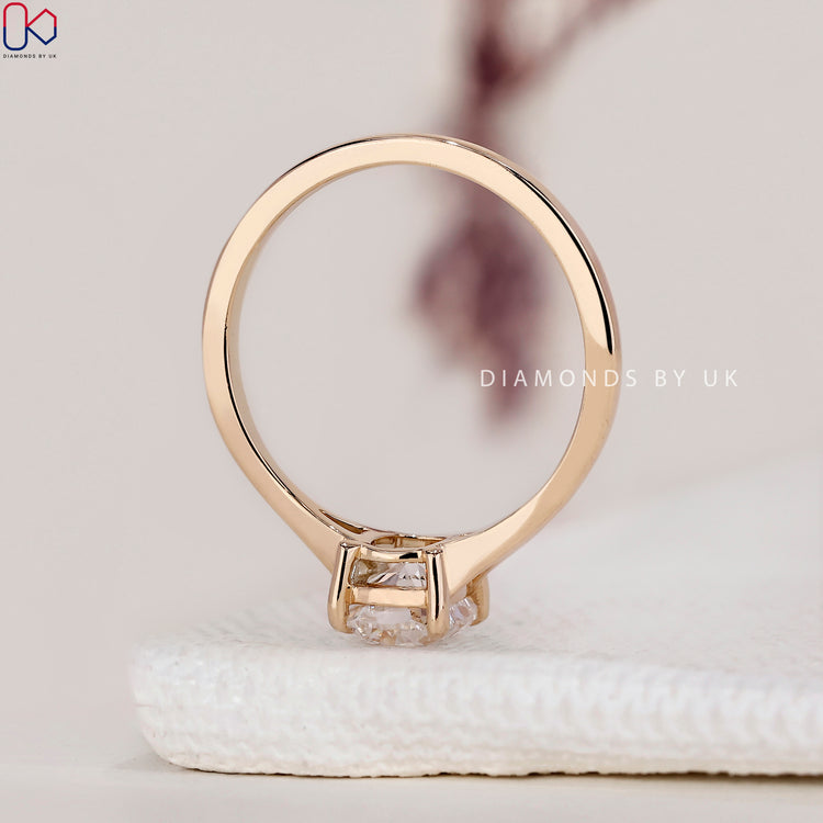Cushion cut engagement ring with split shank.