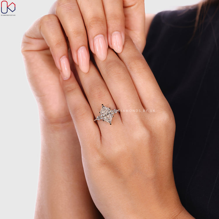 Dutch marquise ring with round side stones and pavé style.  
