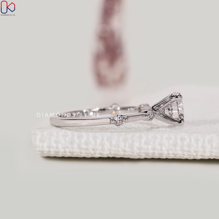 Handmade round engagement ring with pavé design.