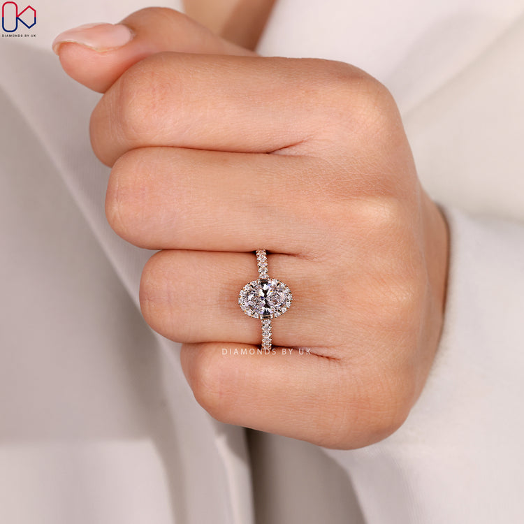 Cathedral oval ring with bridge accents and pavé.

