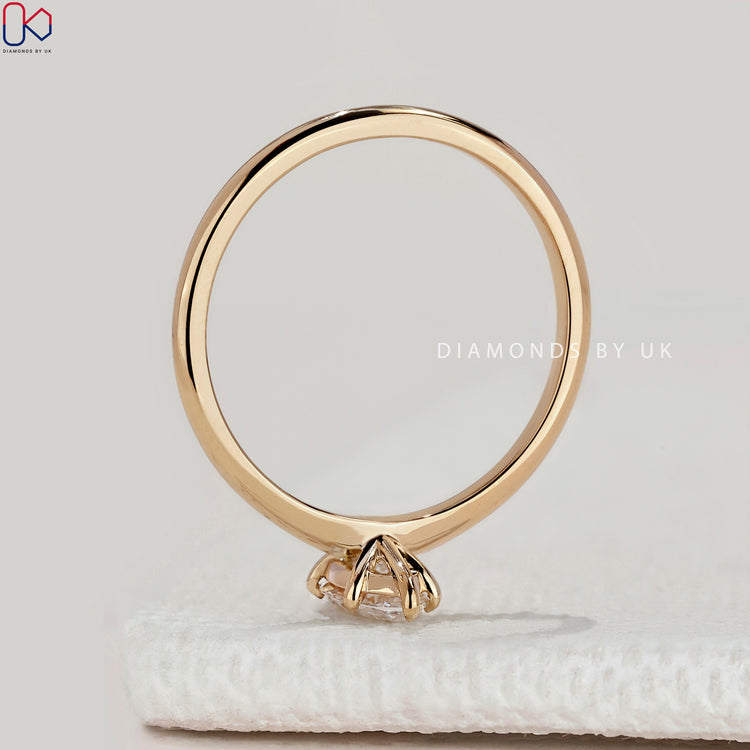 Marquise cut solitaire ring with secure six claws.