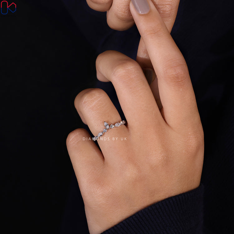 Marquise diamond band with round stones and chevron style.
