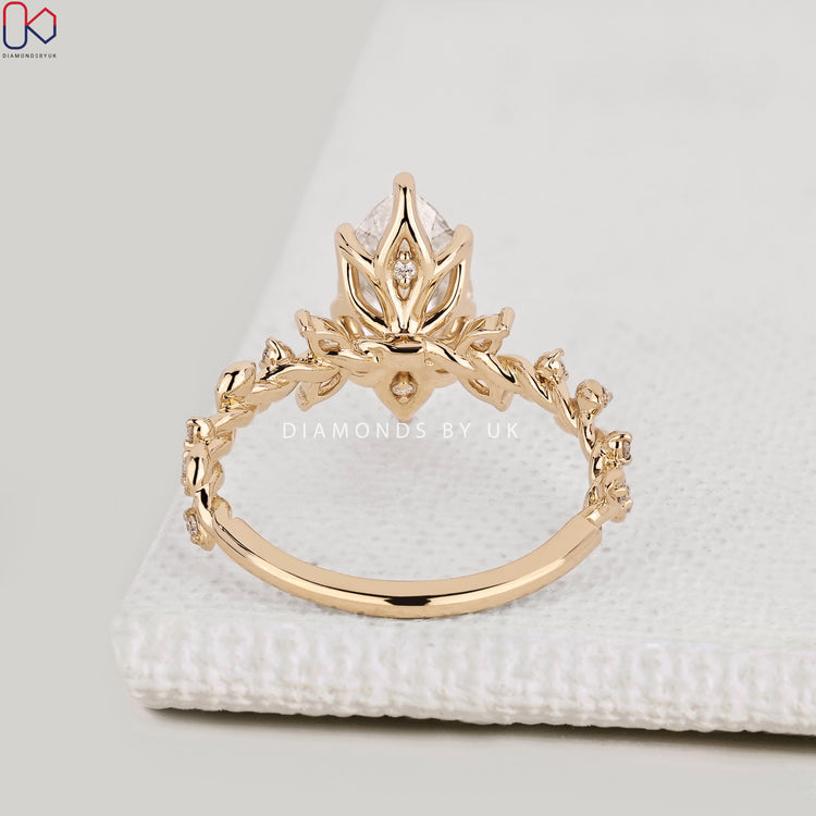 Handmade marquise cut diamond ring with cluster setting.
