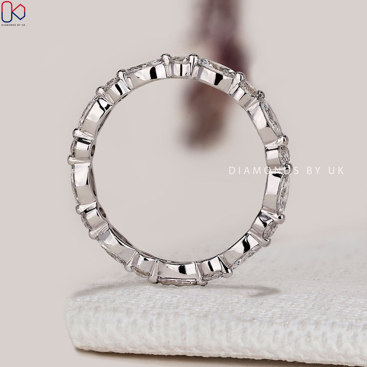 Lab grown marquise and round diamond wedding band.
